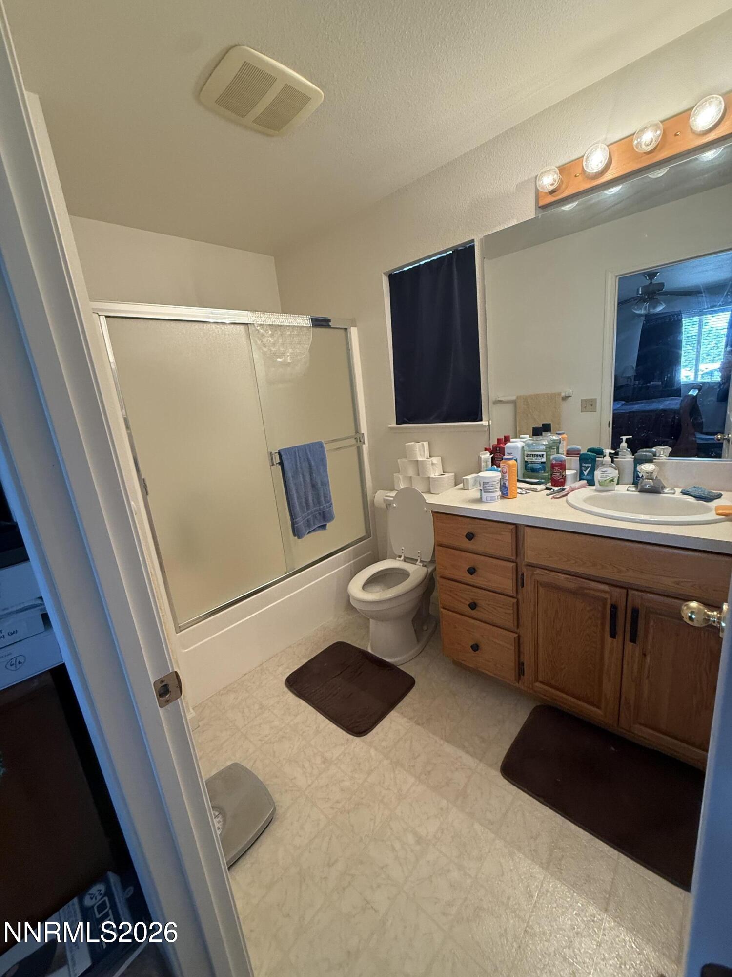 5424 Desert Hills Loop Fallon, NV 89406 - Photo 3 of 21 a bathroom with a sink a washer and dryer
