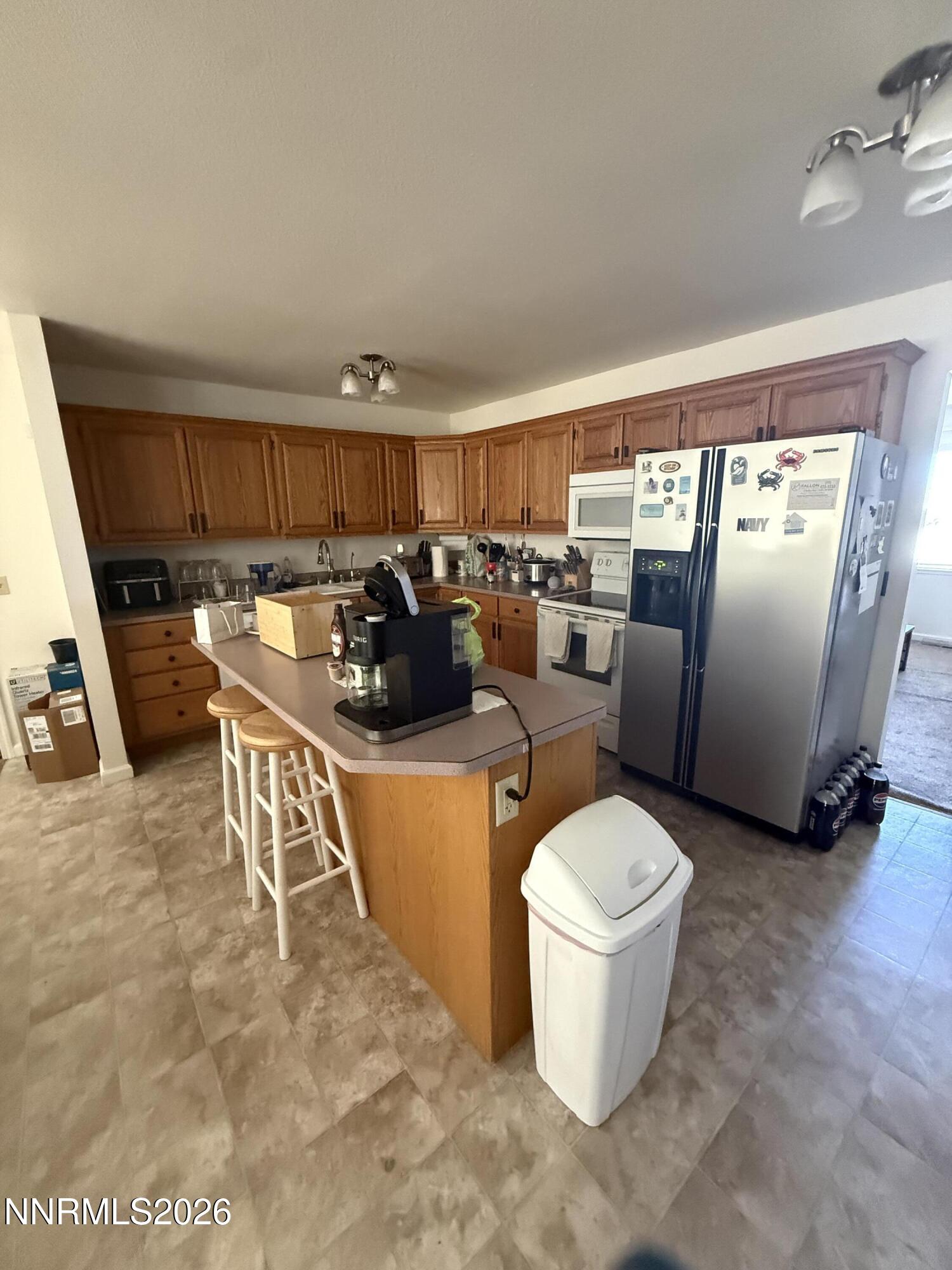 5424 Desert Hills Loop Fallon, NV 89406 - Photo 7 of 21 a living room with furniture a flat screen tv and a fireplace