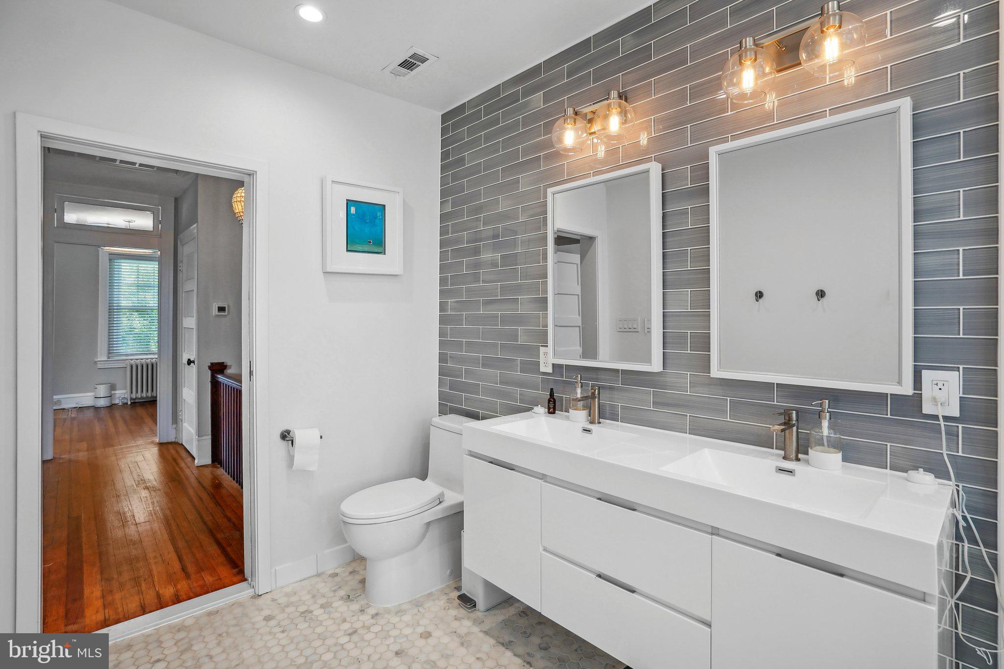 626 D Street Northeast Washington, DC 20002 - Photo 17 of 26 Double Sinks, Tile Floor & Walls - Modern Elegance