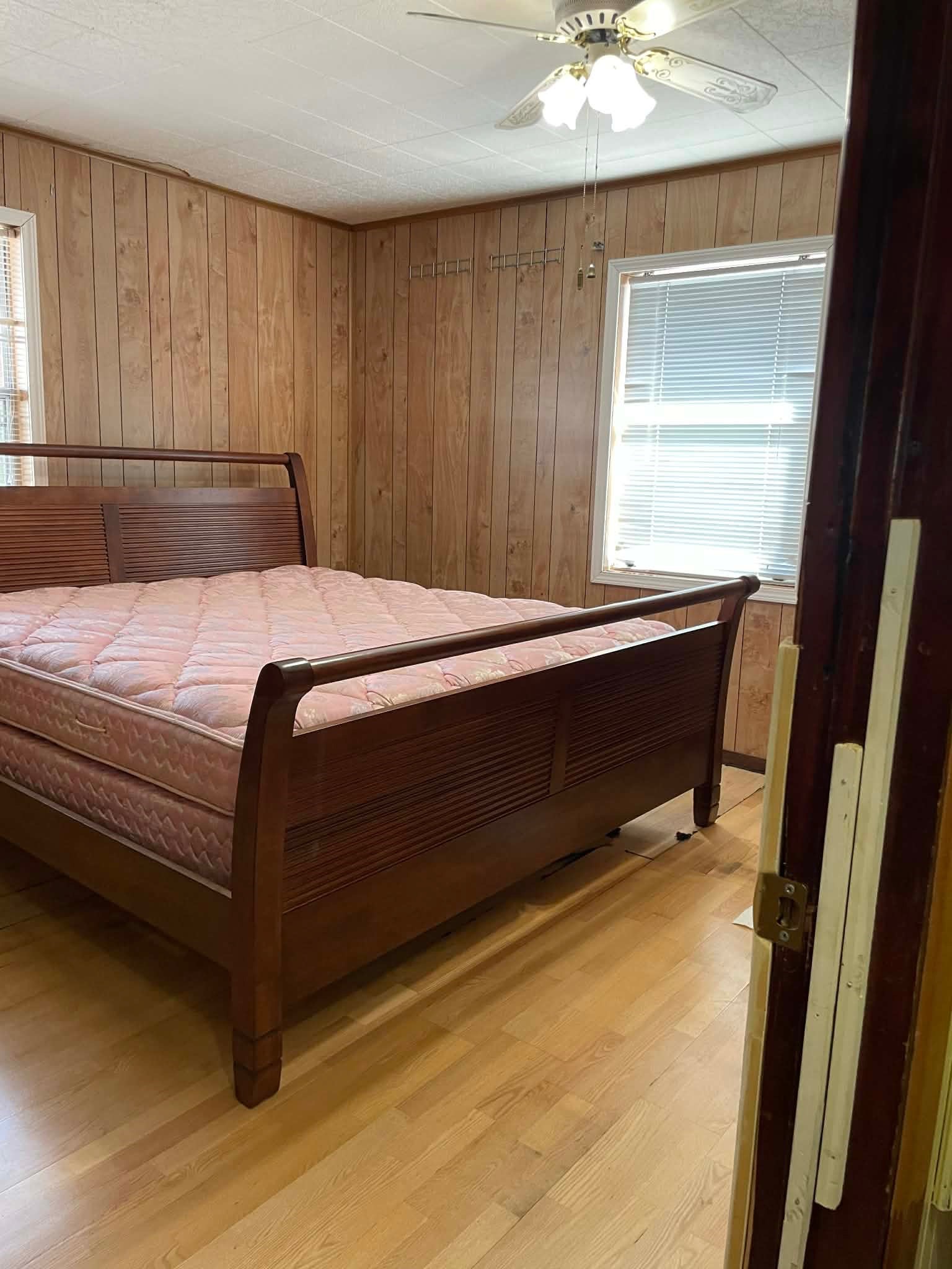 1825 Isom Street Houston, TX 77039 - Photo 15 of 27 a bed sitting in a bedroom next to a window