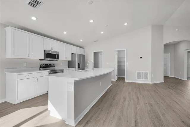 a view of kitchen with wooden floor and window