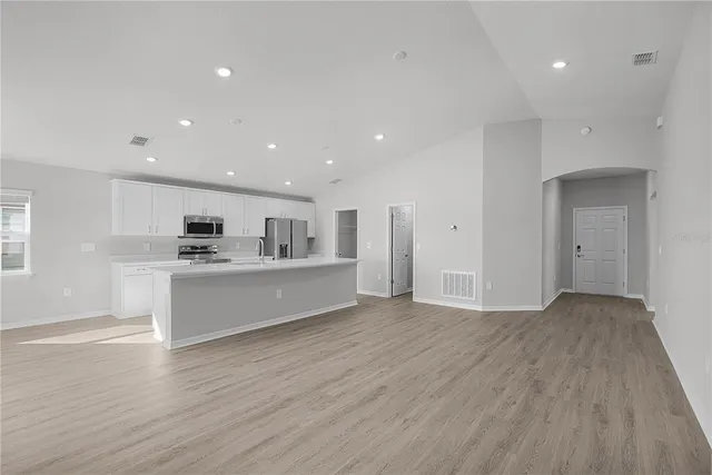 a view of a kitchen with a refrigerator