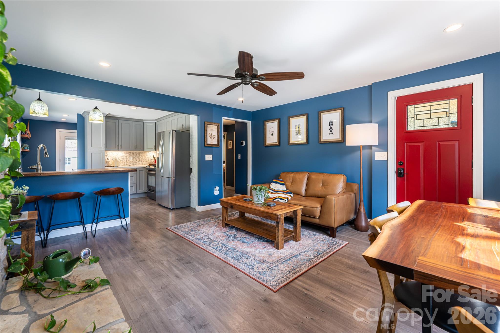 86 Rolling Hills Road Canton, NC 28716 - Photo 11 of 48 a bedroom with furniture and a chandelier