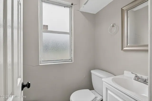 a kitchen with a refrigerator and cabinets