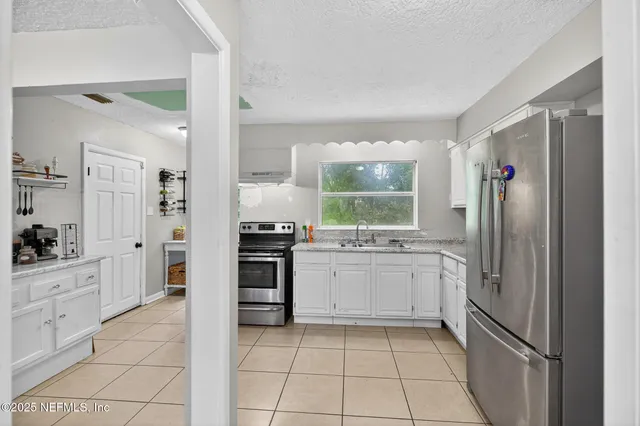 a view of a workspace with furniture