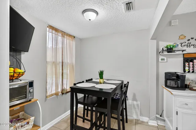 a kitchen with cabinets and appliances