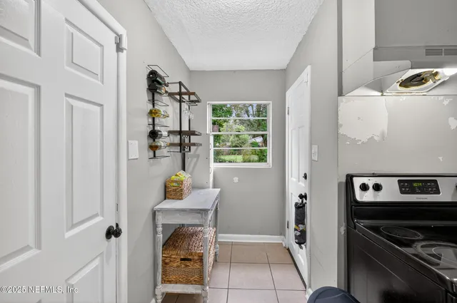 a kitchen with a stove sink and refrigerator