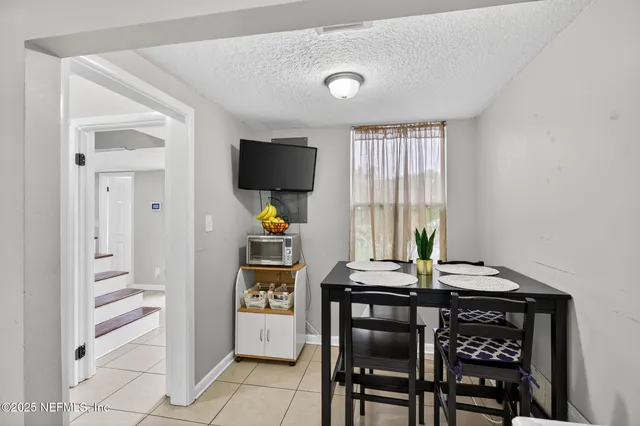 a kitchen with a stove a sink and a refrigerator