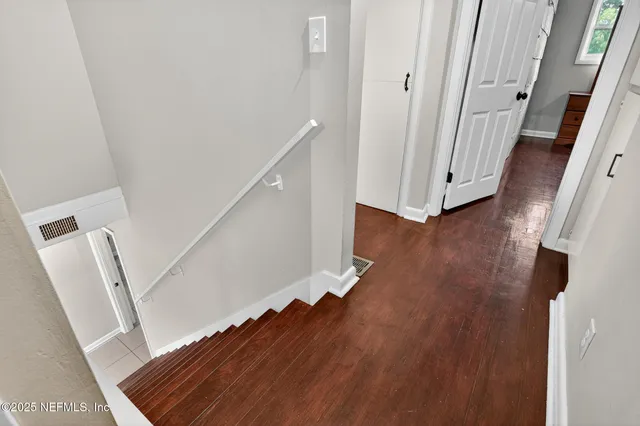 a bathroom with a toilet a sink and a mirror