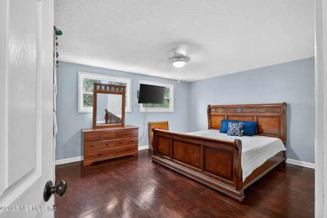 a bedroom with a bed and a large closet