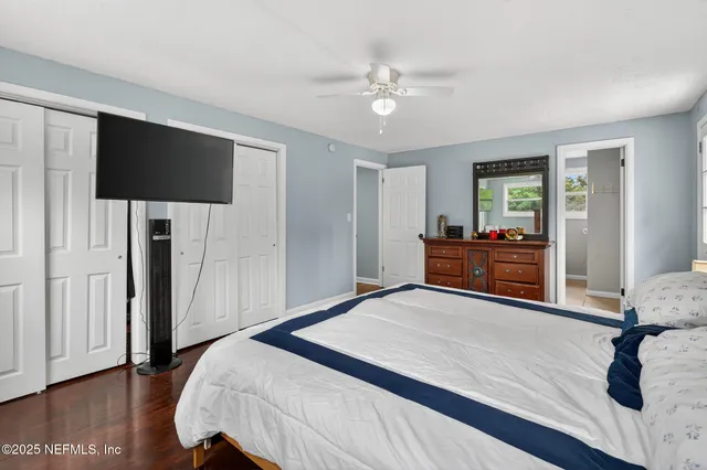 a bedroom with furniture and a window