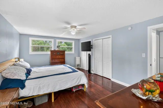 a bathroom with a sink vanity granite and toilet