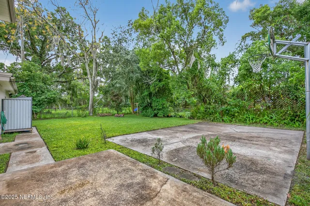 a backyard of a house with lots of green space