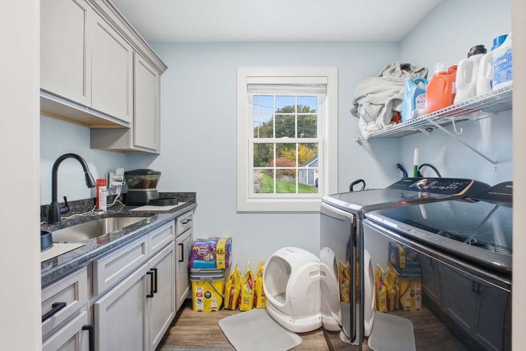 39 Jean Circle Chicopee, MA 01020 - Photo 16 of 33 a kitchen with a sink a stove and cabinets