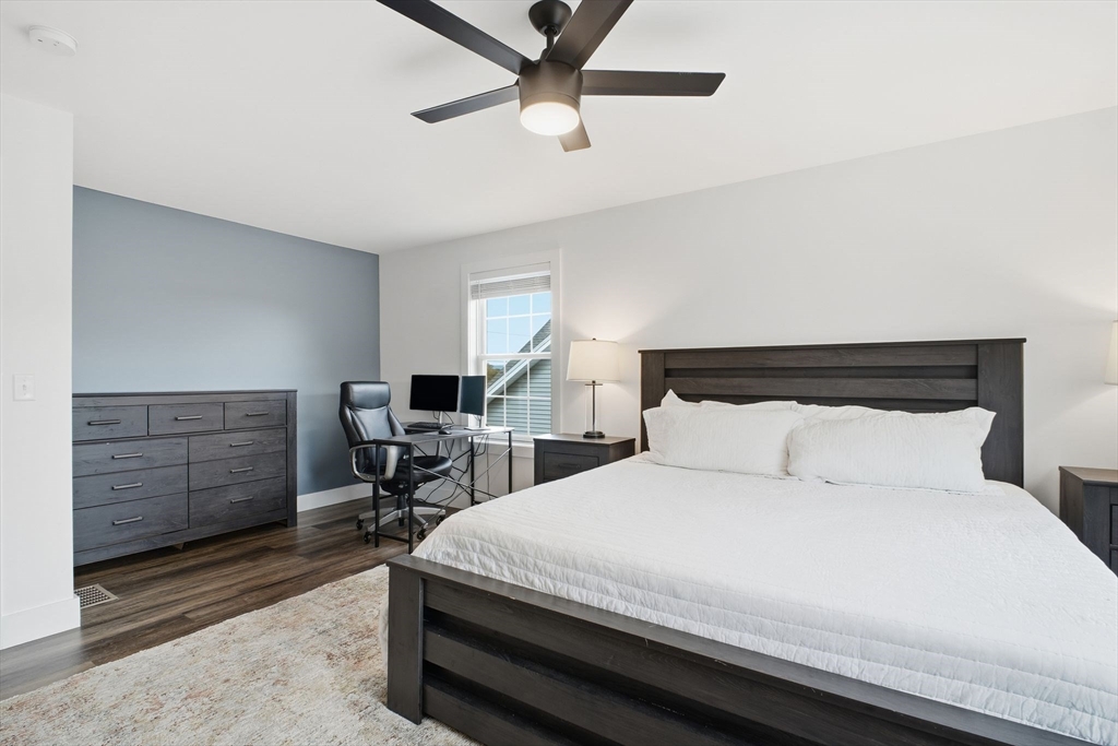 39 Jean Circle Chicopee, MA 01020 - Photo 23 of 33 a bedroom with a bed a table and chair