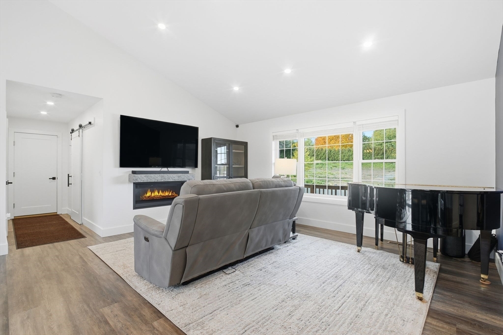 39 Jean Circle Chicopee, MA 01020 - Photo 6 of 33 a living room with furniture and a flat screen tv