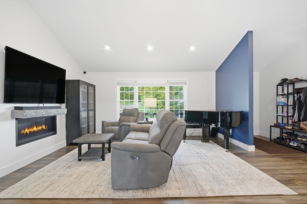 39 Jean Circle Chicopee, MA 01020 - Photo 8 of 33 a living room with furniture and a flat screen tv