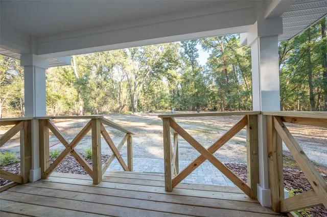 a view of a porch and wooden floor