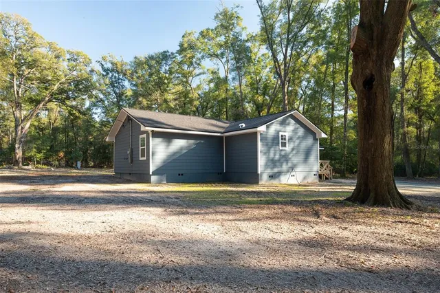 a house with trees in the background