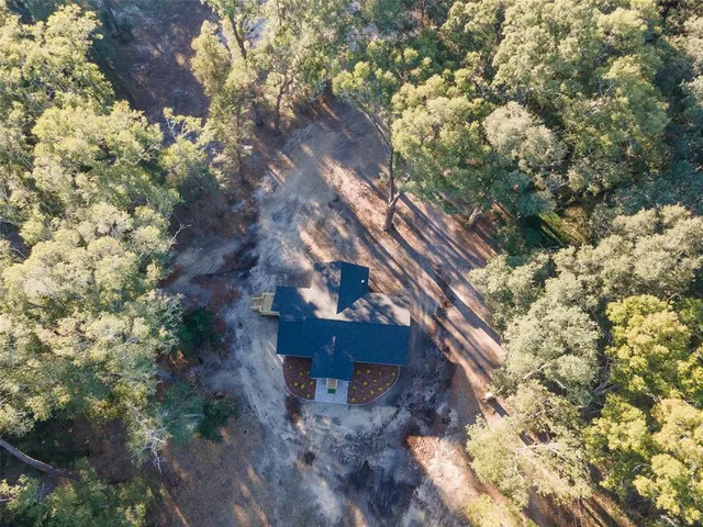 a view of a house with a tree