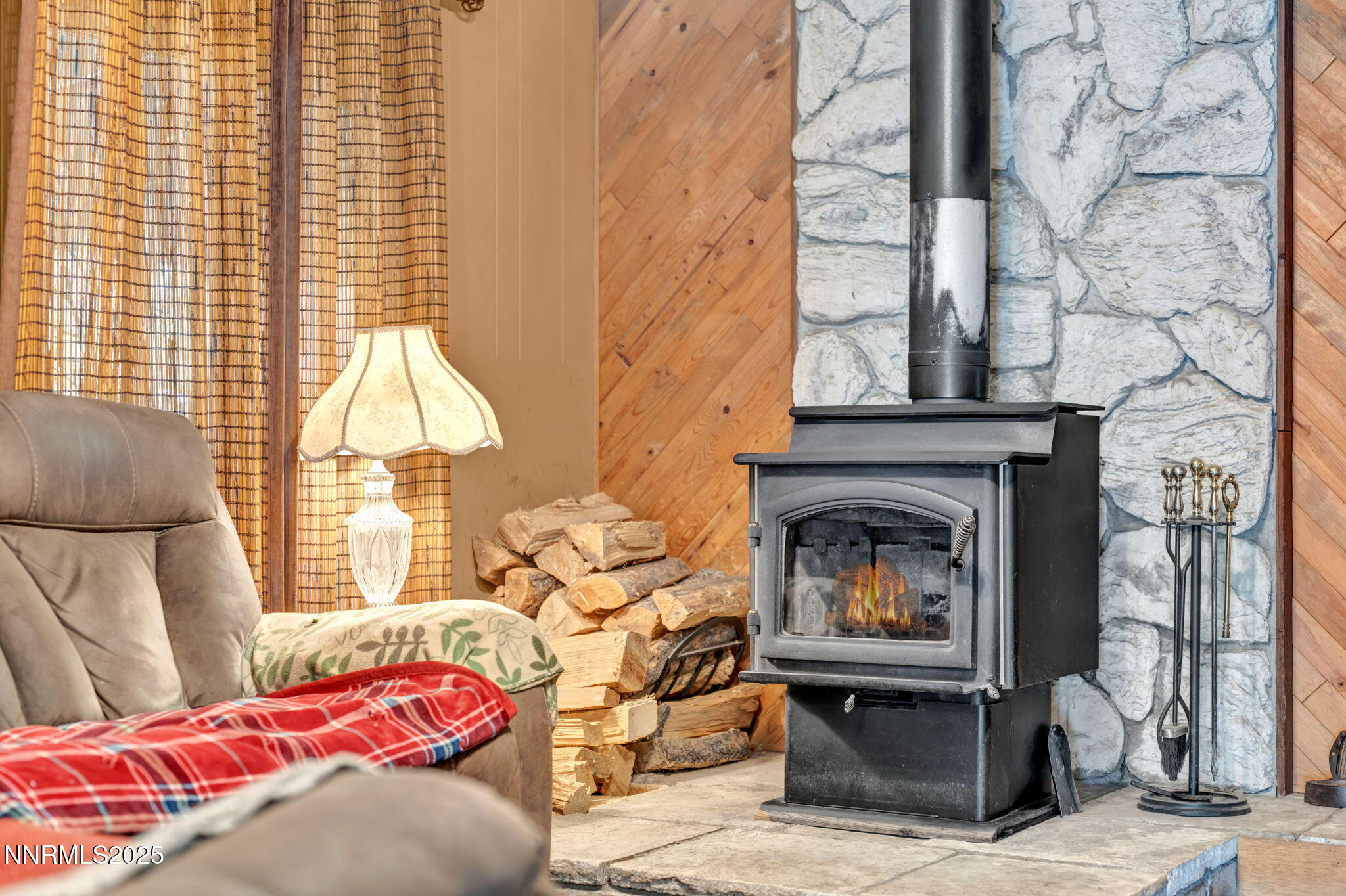 4000 Bobolink Circle Reno, NV 89508 - Photo 11 of 66 a living room with a fireplace furniture and a window