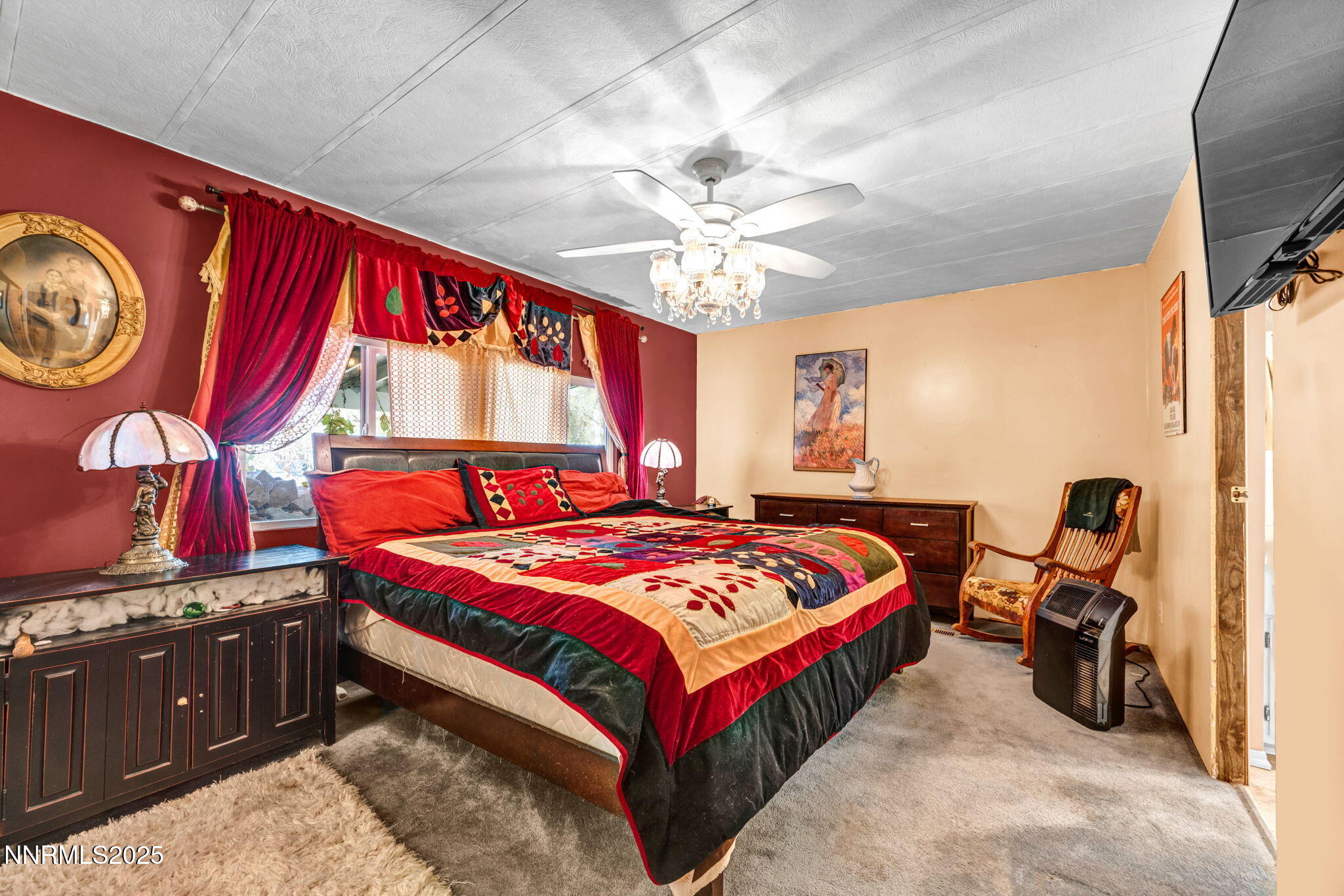 4000 Bobolink Circle Reno, NV 89508 - Photo 14 of 66 a bedroom with a bed and a chandelier