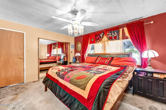 a bed room with a bed and a window