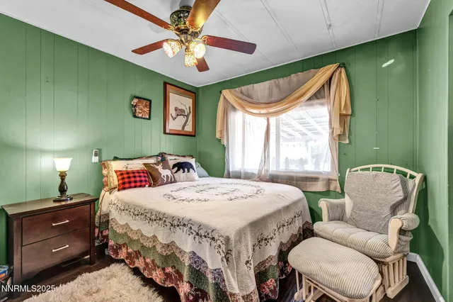 a bedroom with a bed and window