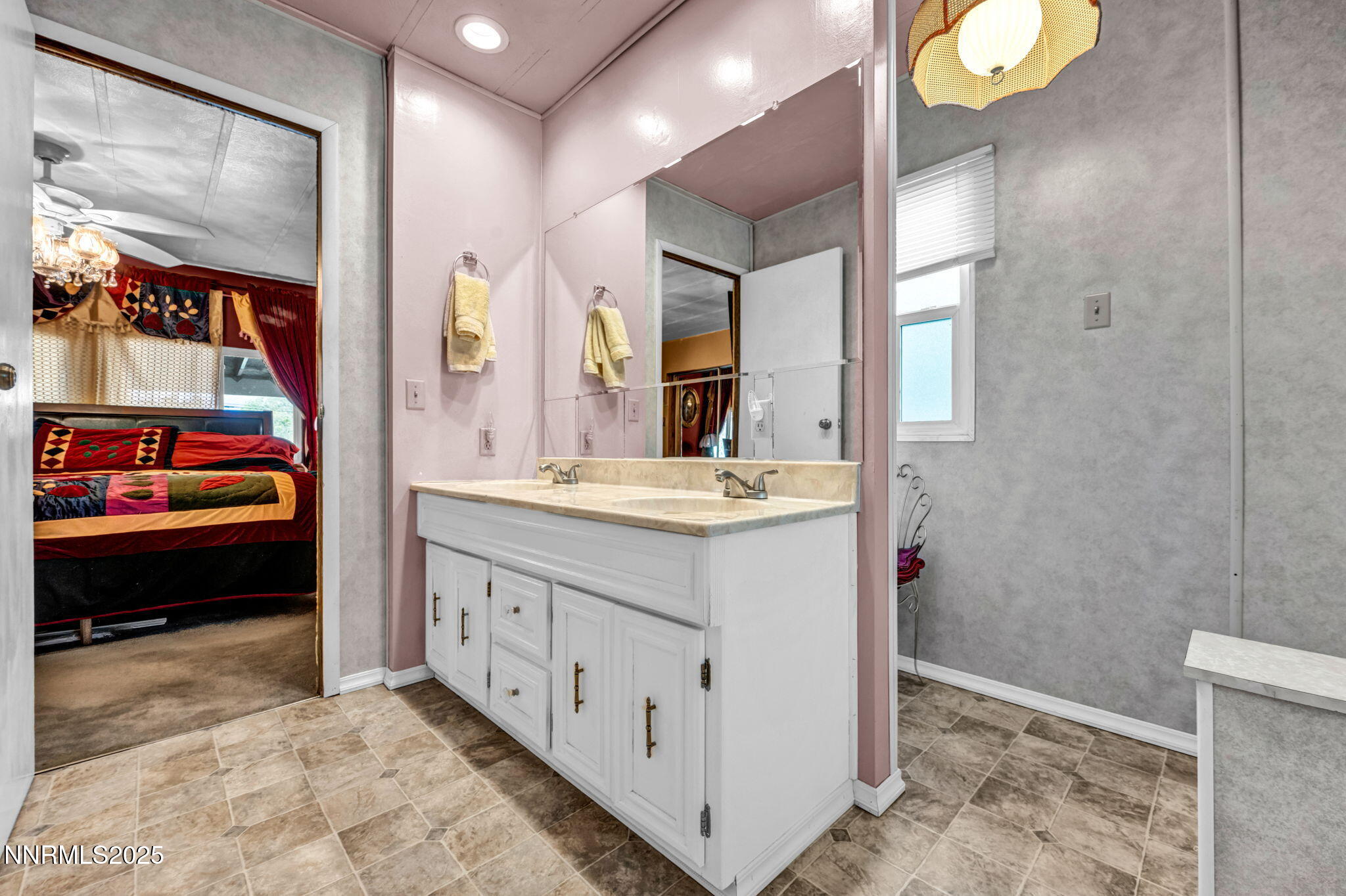 4000 Bobolink Circle Reno, NV 89508 - Photo 21 of 66 a bathroom with a sink a vanity and a mirror