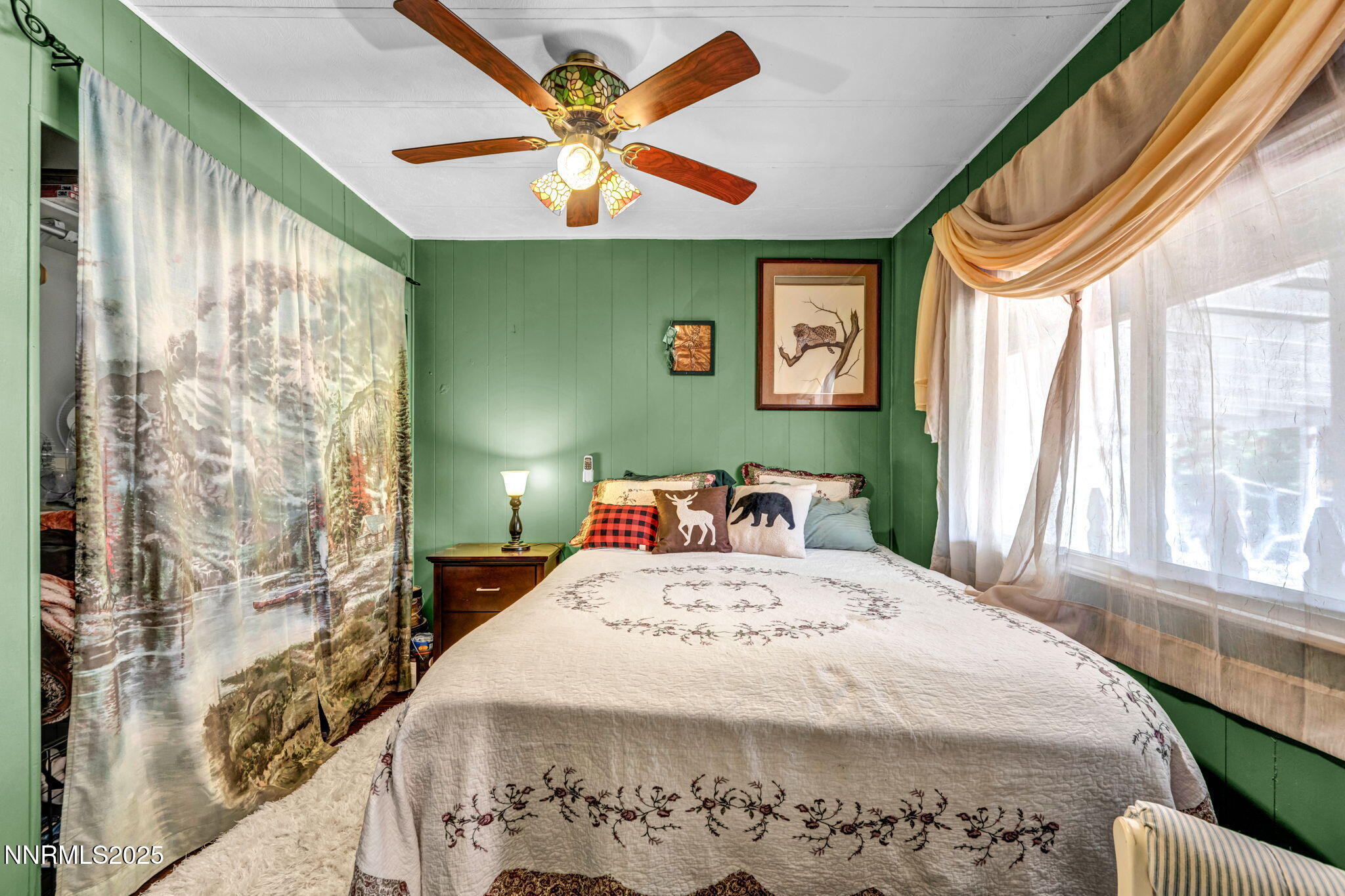 4000 Bobolink Circle Reno, NV 89508 - Photo 23 of 66 a bedroom with a bed and a chandelier