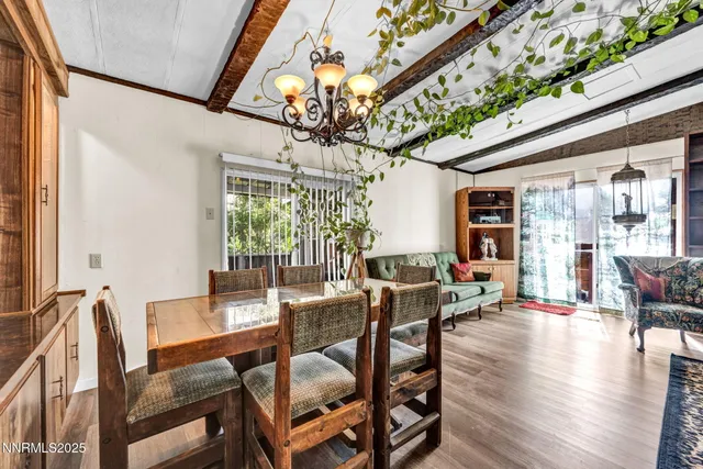 a living room with furniture a rug and white walls