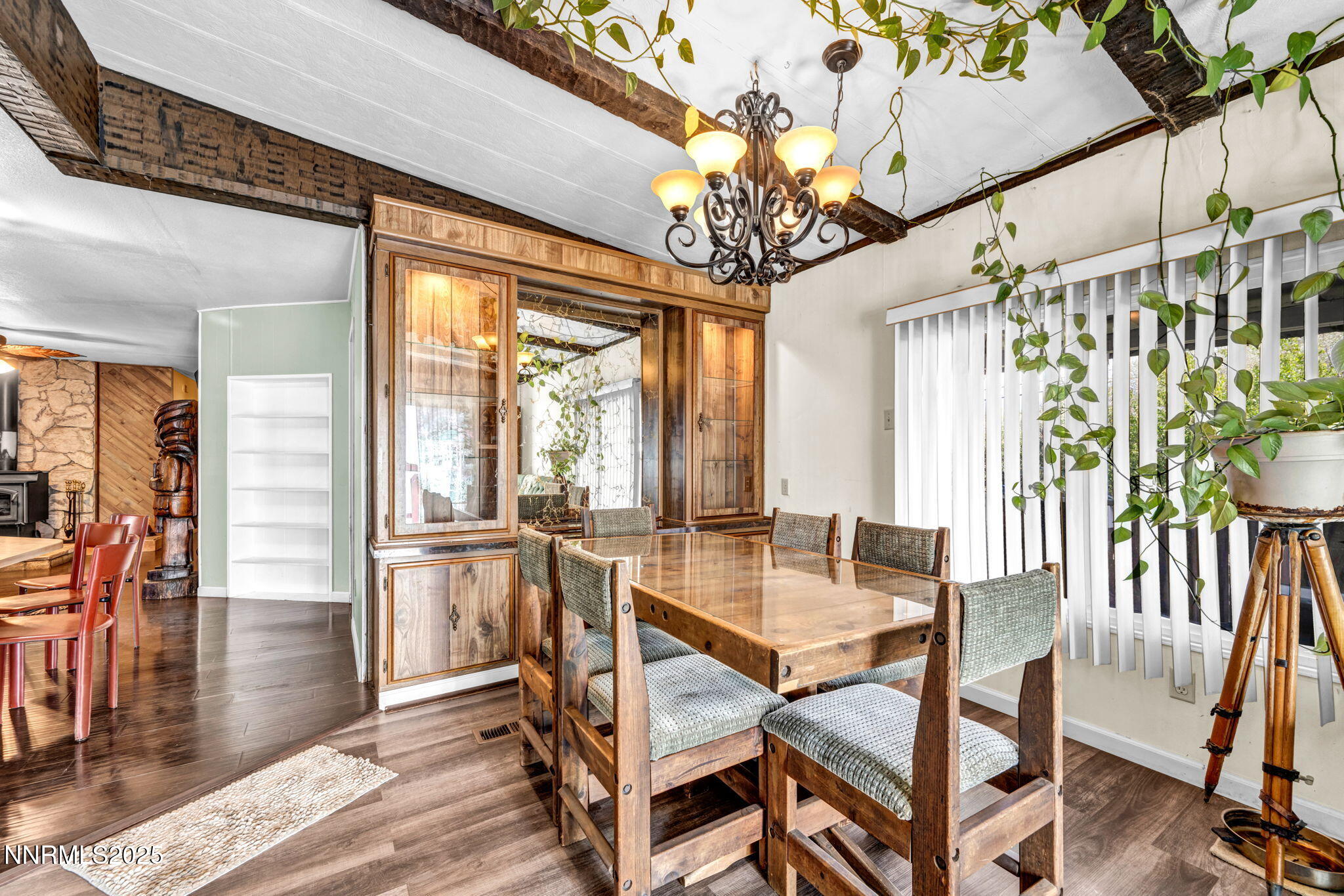 4000 Bobolink Circle Reno, NV 89508 - Photo 25 of 66 a dining room with wooden floor a chandelier a wooden table and chairs