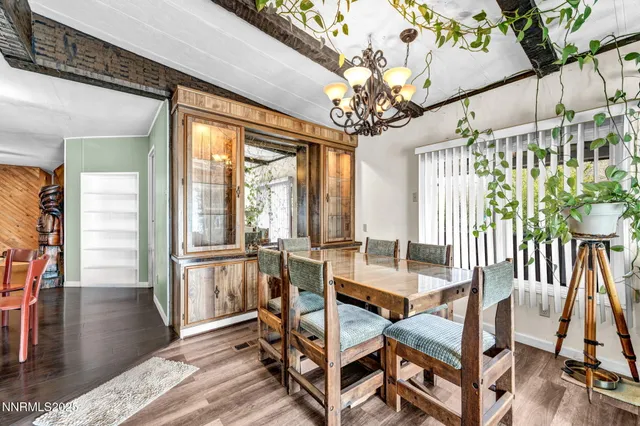 a large kitchen with kitchen island a large counter space and stainless steel appliances