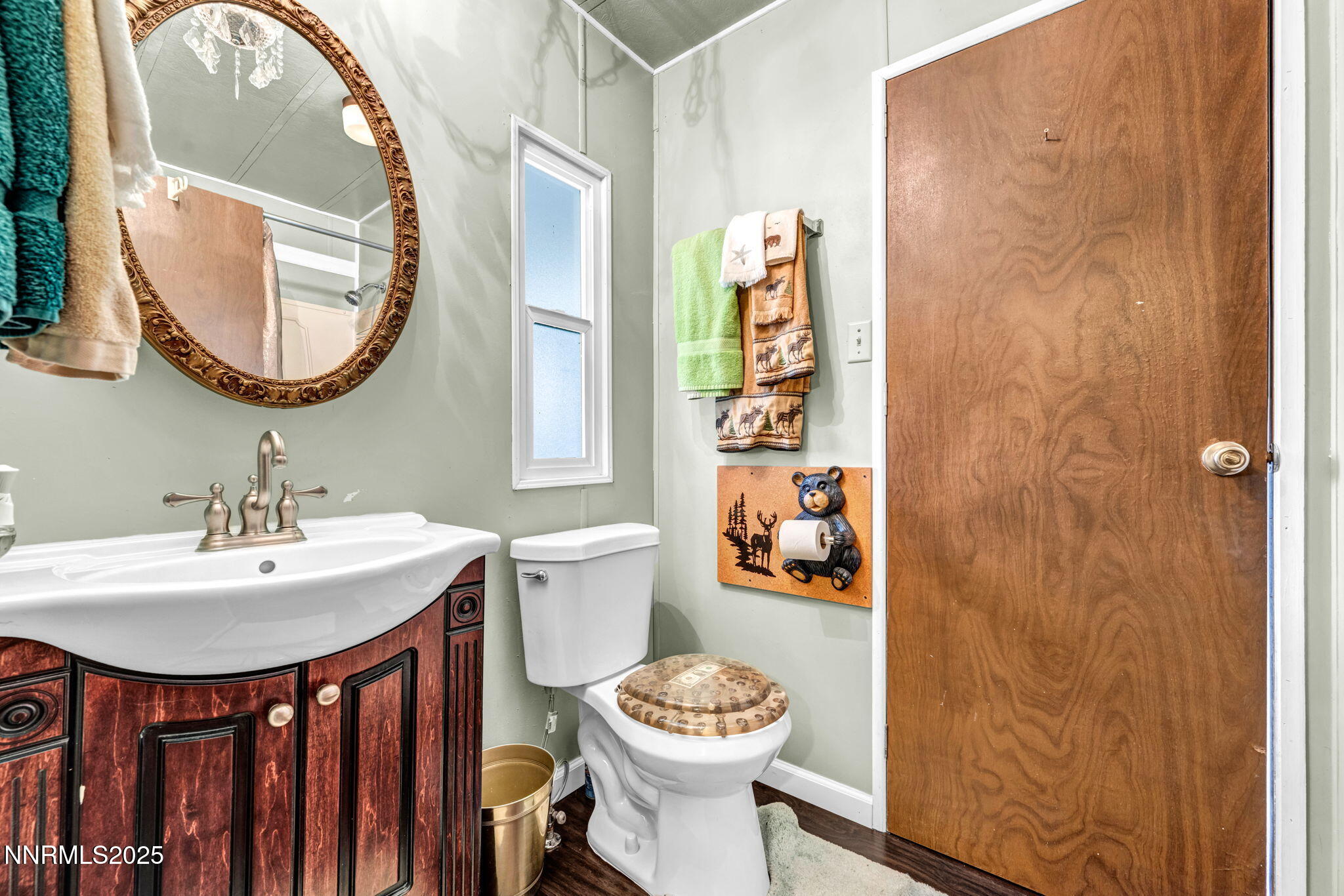 4000 Bobolink Circle Reno, NV 89508 - Photo 34 of 66 a bathroom with a sink a mirror and a toilet