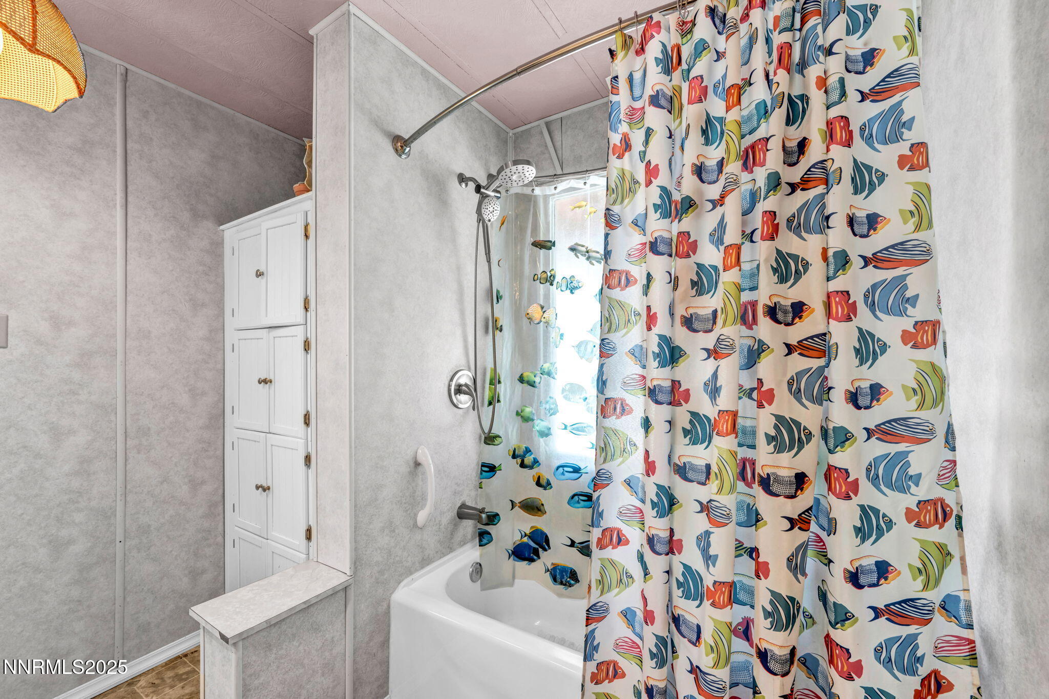 4000 Bobolink Circle Reno, NV 89508 - Photo 36 of 66 a bathroom with a bathtub and a shower curtain