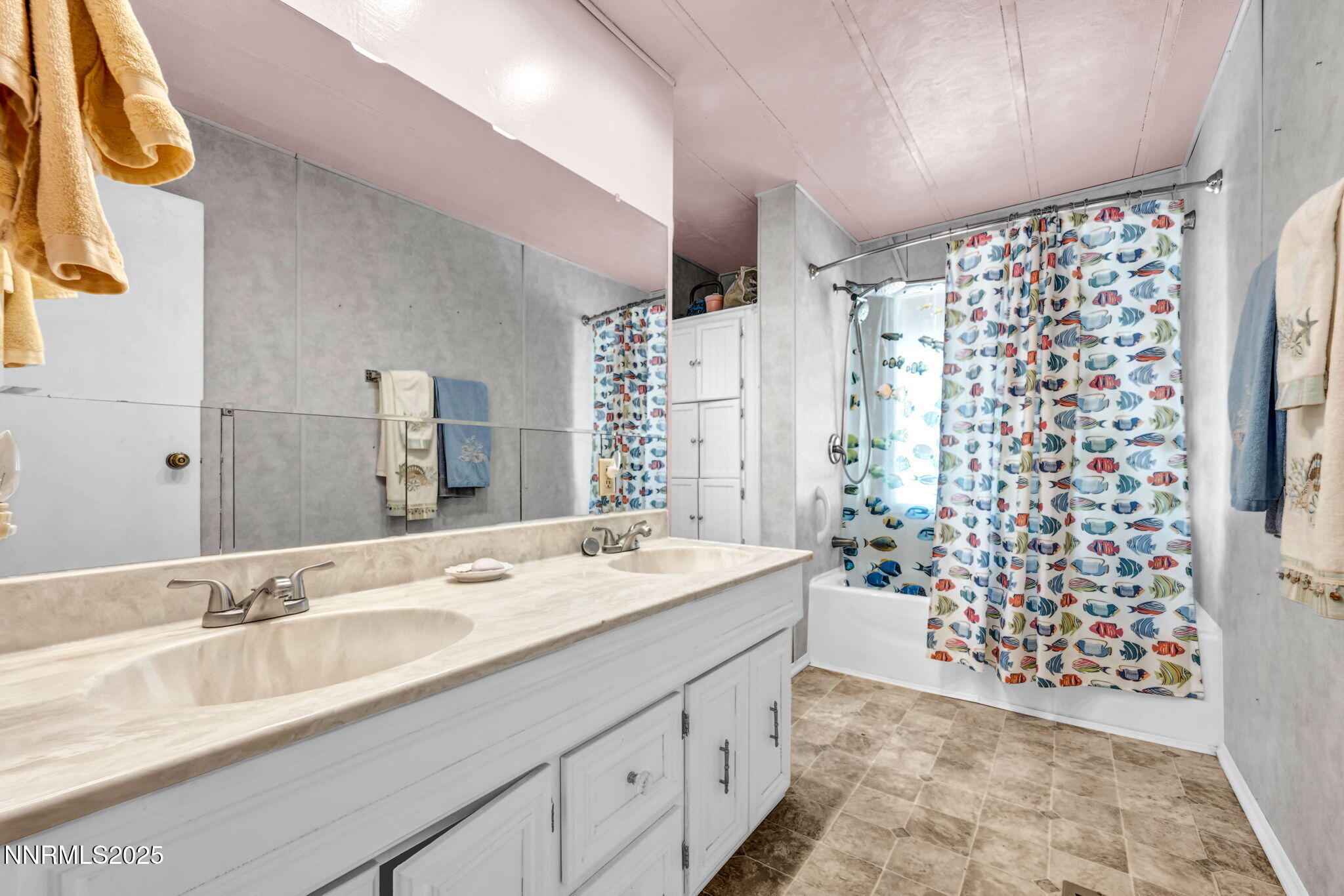 4000 Bobolink Circle Reno, NV 89508 - Photo 37 of 66 a bathroom with a sink a vanity and a shower