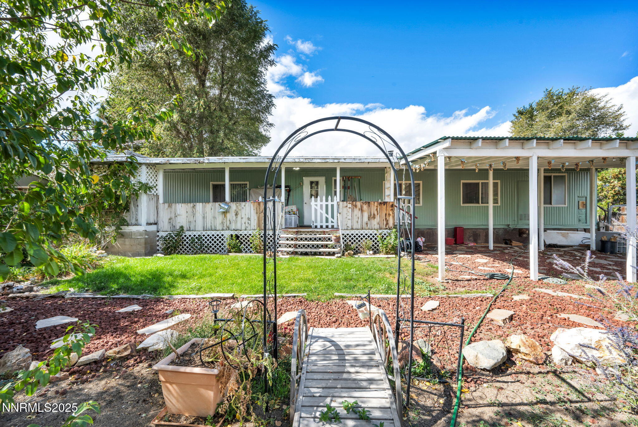 4000 Bobolink Circle Reno, NV 89508 - Photo 44 of 66 a view of a house with backyard porch and garden