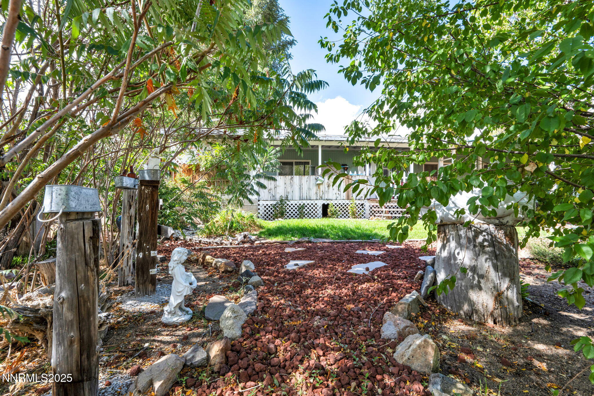 4000 Bobolink Circle Reno, NV 89508 - Photo 51 of 66 a view of a yard with plants and large trees