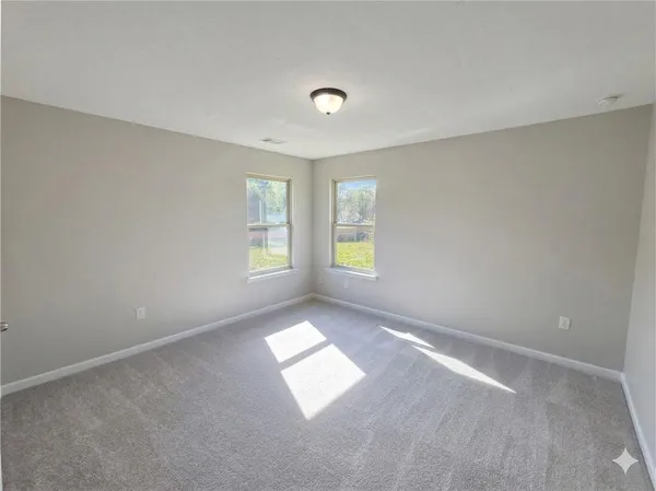 an empty room with windows