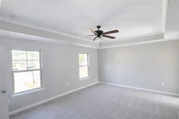 a view of a livingroom with a ceiling fan and window