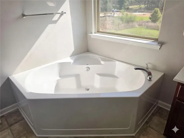 a view of a bathtub in a bathroom