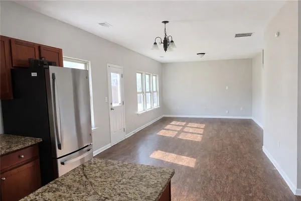 a view of livingroom with hardwood floor and hallway