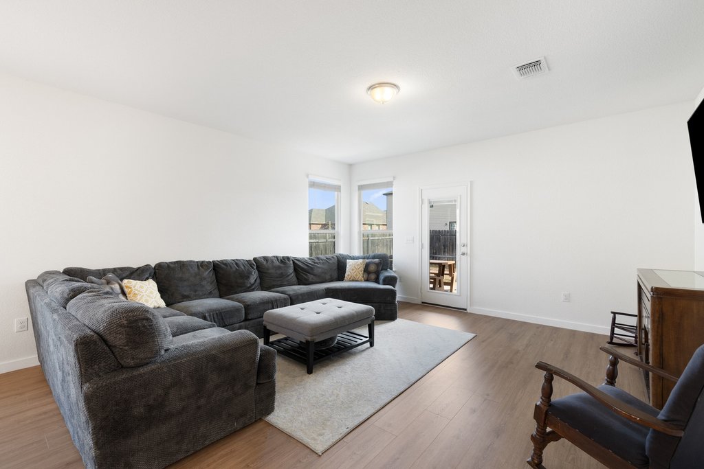 1926 Dragonfly Loop Bastrop, TX 78602 - Photo 13 of 32 a living room with furniture and a couch