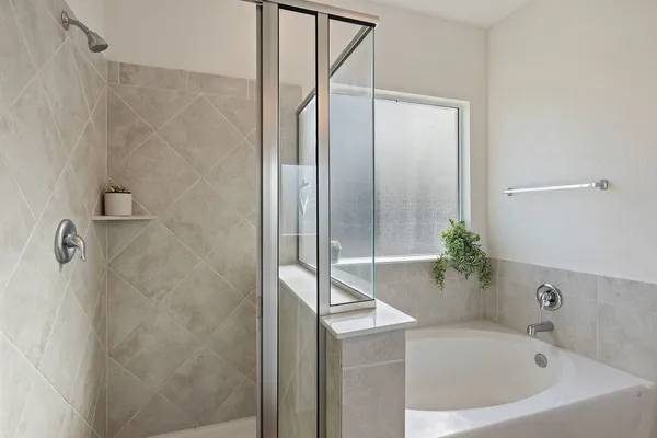 a bathroom with double vanity sinks and a mirror