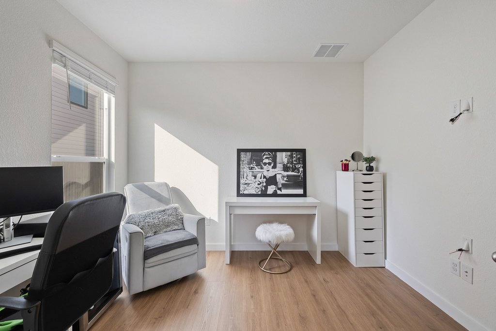 1926 Dragonfly Loop Bastrop, TX 78602 - Photo 21 of 32 a living room with furniture and a flat screen tv