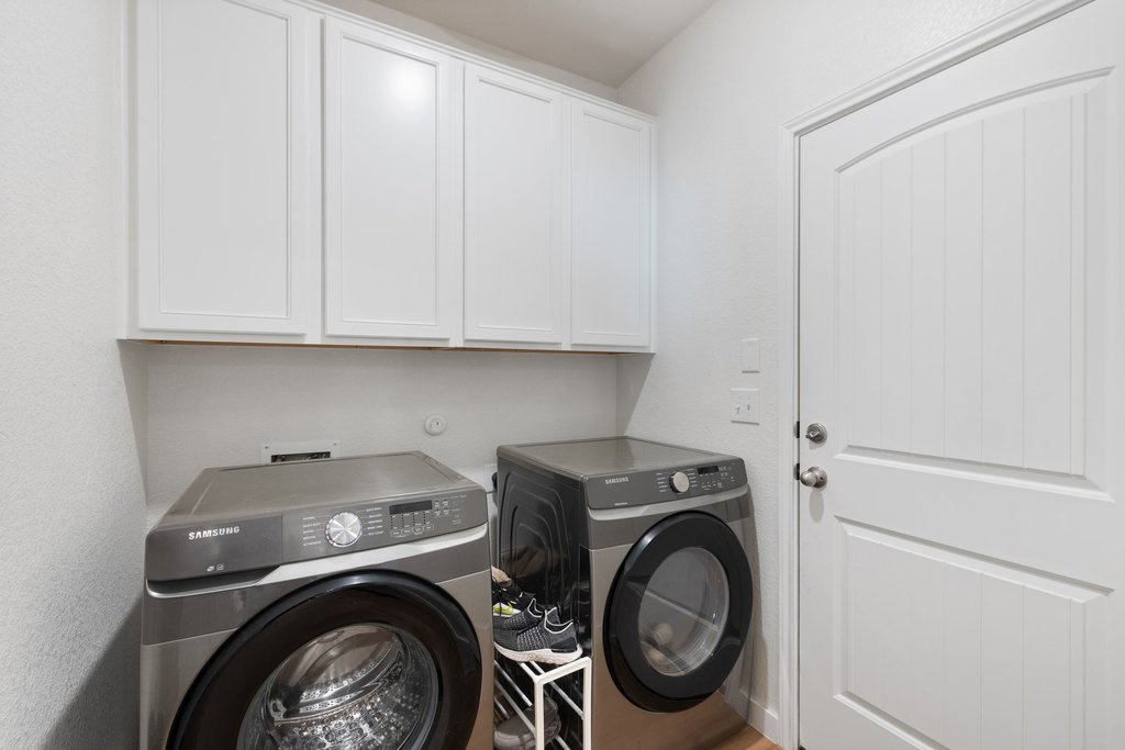 1926 Dragonfly Loop Bastrop, TX 78602 - Photo 26 of 32 a utility room with dryer and washer