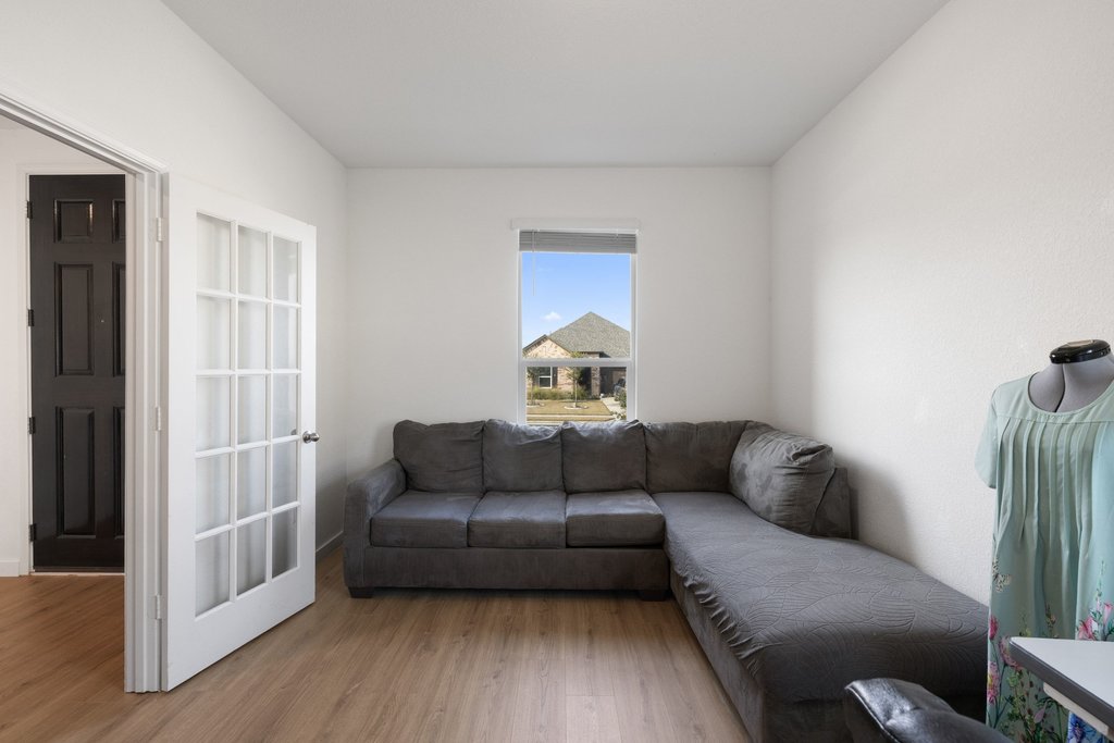 1926 Dragonfly Loop Bastrop, TX 78602 - Photo 3 of 32 a living room with furniture and a wooden floor