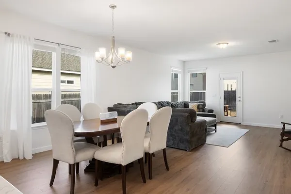a kitchen with a sink window and cabinets