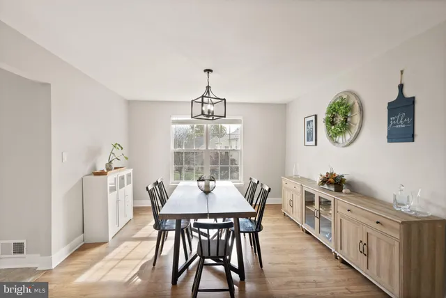 a kitchen with stainless steel appliances granite countertop a refrigerator a stove top oven a sink dishwasher and cabinets