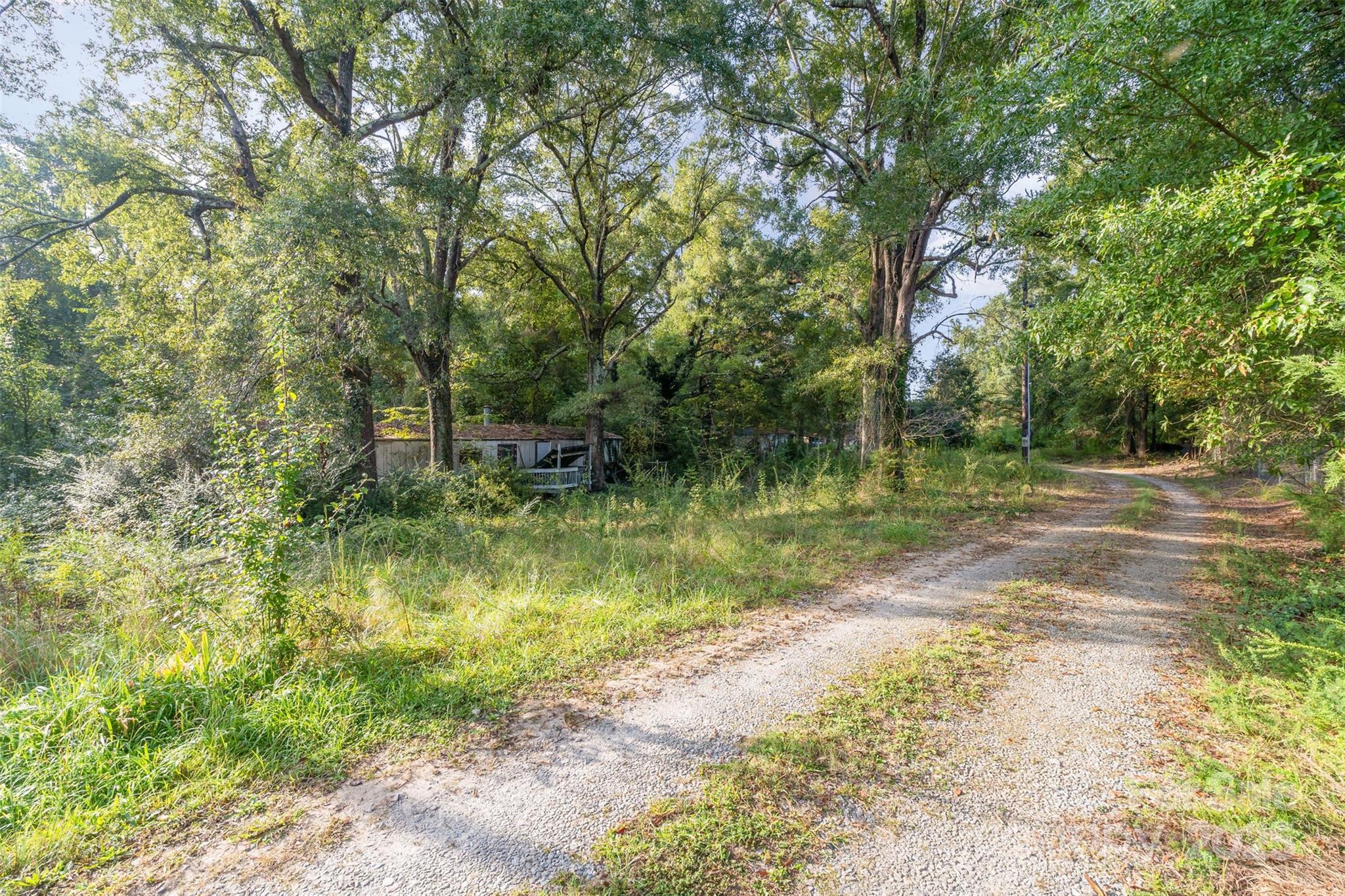 3164 Andrew Link Road Iron Station, NC 28080 - Photo 2 of 17 a view of a lake view with a garden